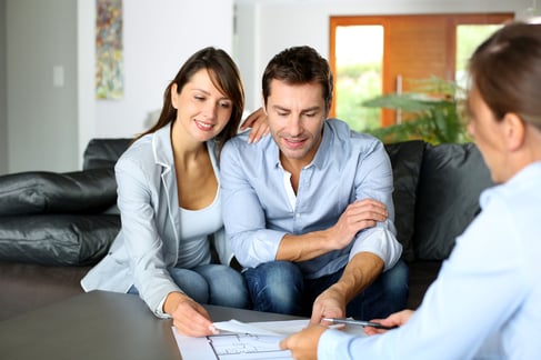 Couple meeting consultant for financial contract