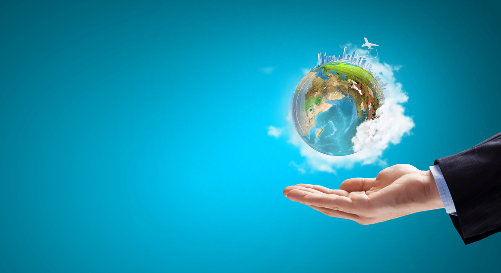 Close up of hand holding Earth planet. Elements of this image are furnished by NASA