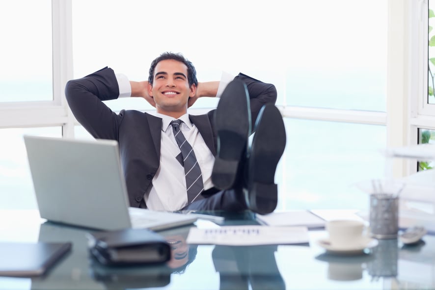 Satisfied businessman relaxing in his office-1