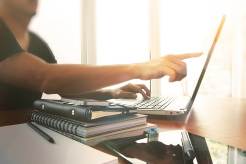 Young creative designer man working at office with computer laptop as concept